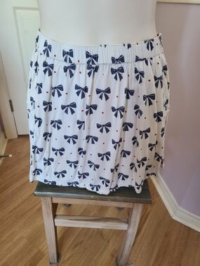 Cooperative White Mini Skirt with Navy Bow & Red Dot Accents